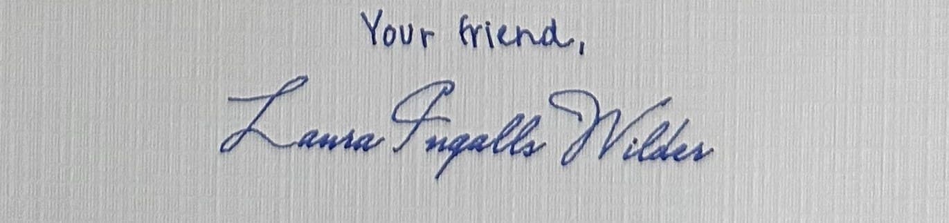 Your friend, Laura Ingalls Wilder, signed by hand in blue ink